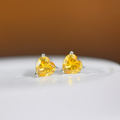 Yellow Heart-Shaped Moissanite Stud Earrings in 925 Sterling Silver with 18K Golden Plating - Set of 2. These vintage-inspired earrings are perfect for the autumn season, Mardi Gras celebrations, and music festivals. They are versatile for both daily