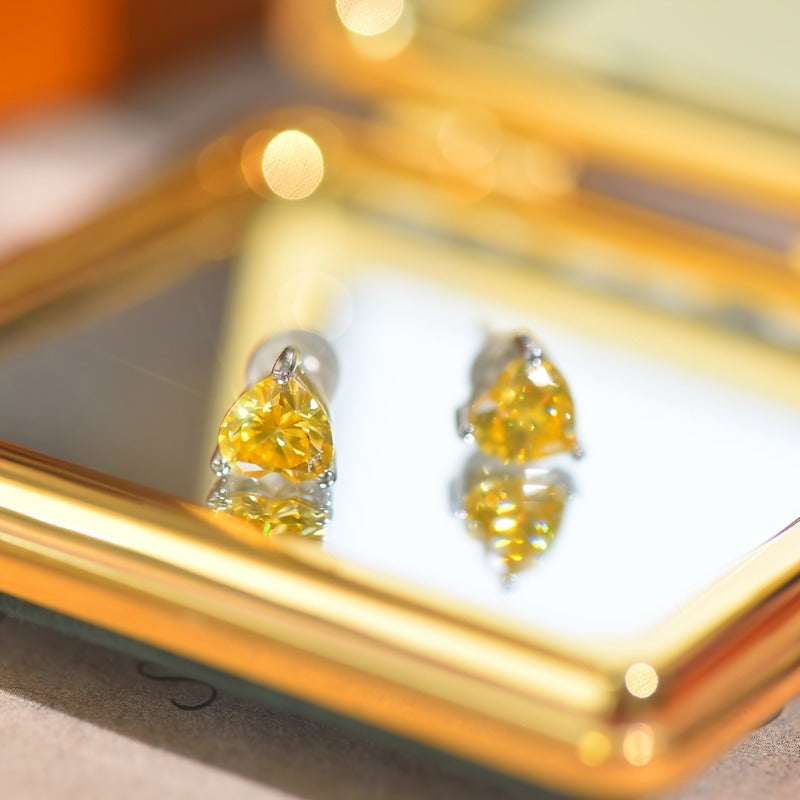 Yellow Heart-Shaped Moissanite Stud Earrings in 925 Sterling Silver with 18K Golden Plating - Set of 2. These vintage-inspired earrings are perfect for the autumn season, Mardi Gras celebrations, and music festivals. They are versatile for both daily