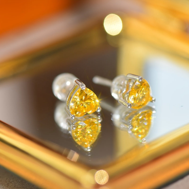 Yellow Heart-Shaped Moissanite Stud Earrings in 925 Sterling Silver with 18K Golden Plating - Set of 2. These vintage-inspired earrings are perfect for the autumn season, Mardi Gras celebrations, and music festivals. They are versatile for both daily