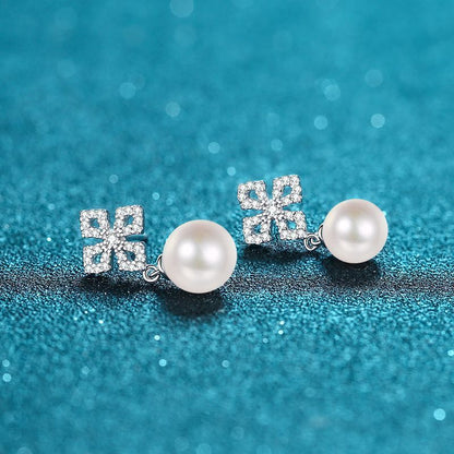 - Two elegant stud earrings made of 925 sterling silver adorned with freshwater pearl, perfect for a vacation style look. Ideal for weddings or as a thoughtful gift for Valentine's Day. Lightweight at 2.2g, these earrings are a perfect gift for women.