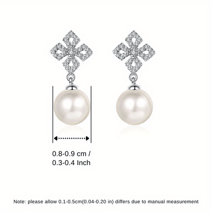 - Two elegant stud earrings made of 925 sterling silver adorned with freshwater pearl, perfect for a vacation style look. Ideal for weddings or as a thoughtful gift for Valentine's Day. Lightweight at 2.2g, these earrings are a perfect gift for women.