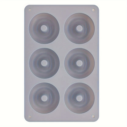 1 piece of a 6-Cavity Silicone Donut Mold for Baking, designed to withstand high temperatures. Ideal for creating large donut cakes, puddings, jellies, and chocolates. Can also be used as a DIY handmade soap, wax, or resin mold. A versatile kitchen tool