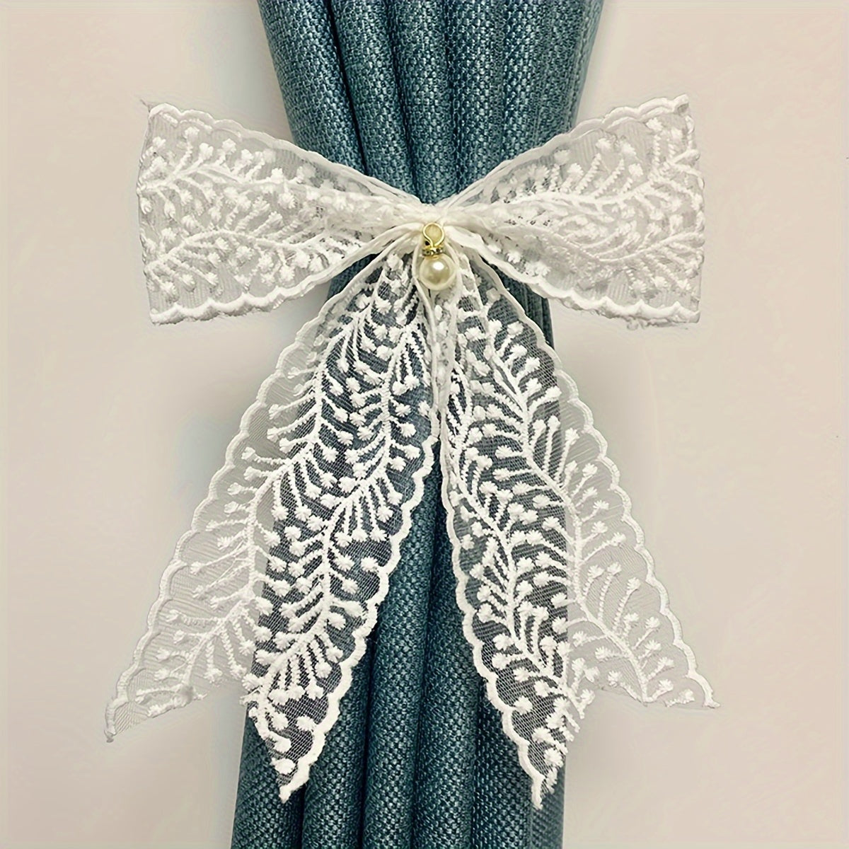 1 Pair of Bow Lace Pearl Curtain Tiebacks - A chic and versatile way to add a touch of elegance to your curtains. These French lace pearl ribbon tiebacks are perfect for use in the bedroom, living room, study, coffee shop, or any other room in your home