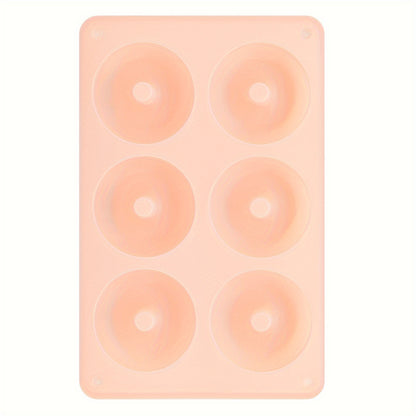 1 piece of a 6-Cavity Silicone Donut Mold for Baking, designed to withstand high temperatures. Ideal for creating large donut cakes, puddings, jellies, and chocolates. Can also be used as a DIY handmade soap, wax, or resin mold. A versatile kitchen tool