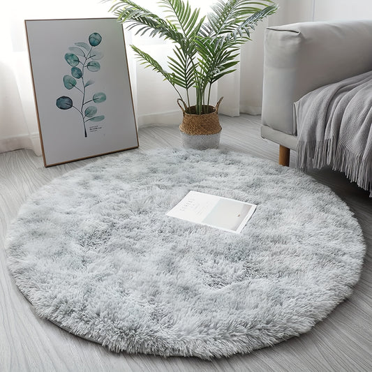 1 piece of a round, fresh, and simple tie-dye light grey plush rug. Made from super soft premium fabric that is furry and skin-friendly, this decorative rug has upgraded fabric with fluffy sponge, thickened, and no shed. It is firm, durable, lightweight