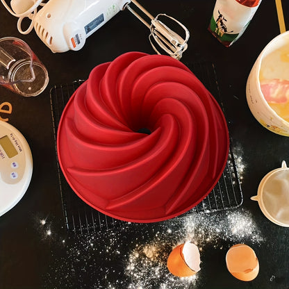 1 piece of Bunte Cake Pan (24.13cm) made of silicone for gelatinas, cakes, and breads. The nonstick pan features a spiral design, perfect for birthday parties.