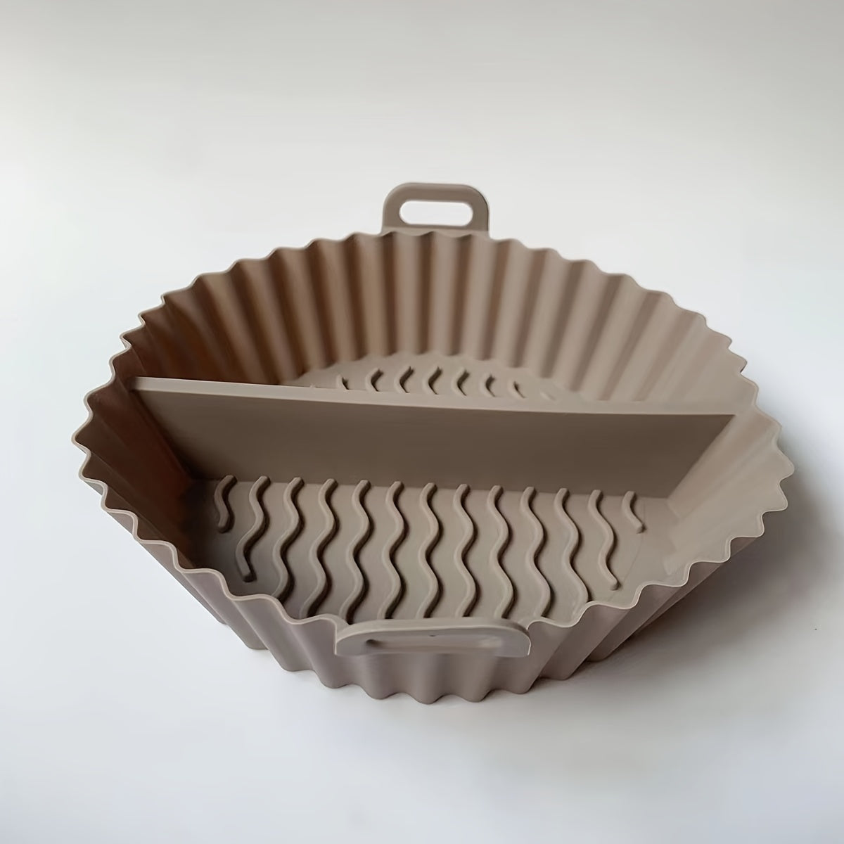 1 piece of a reusable air fryer liner that doubles as a divided air fryer baking pan and food grade silicone baking mat. This high temperature resistant silicone cake mold is a must-have for any kitchen, perfect for baking supplies and accessories. Ideal