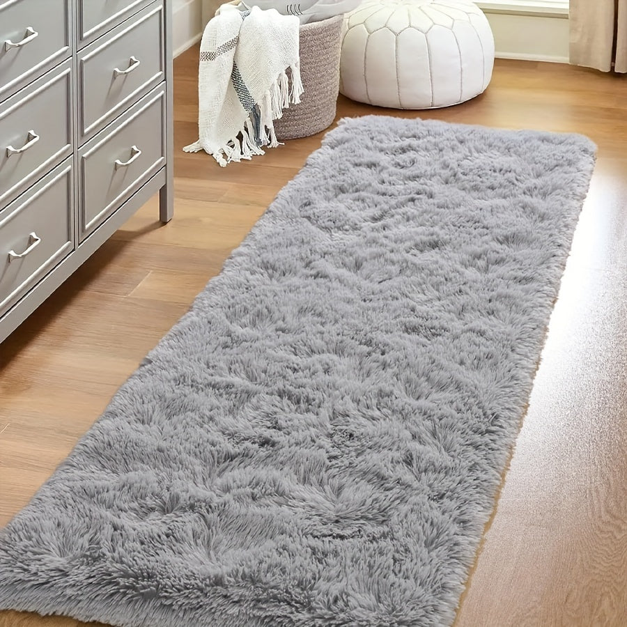 1 piece of a fluffy plush rug suitable for bedroom and living room decor. This comfortable bedside rug adds a touch of coziness to any room. Its furry and decorative design makes it a perfect addition to your indoor decor.