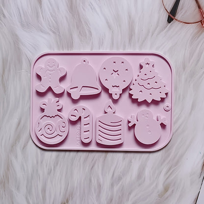 1 piece of Christmas Silicone Cookie Mold with 8 cavities, featuring shapes of Christmas tree, elk, bell, and snowman. This versatile mold can be used to make cakes, chocolates, biscuits, candies, jellies, and puddings. Perfect for creating festive