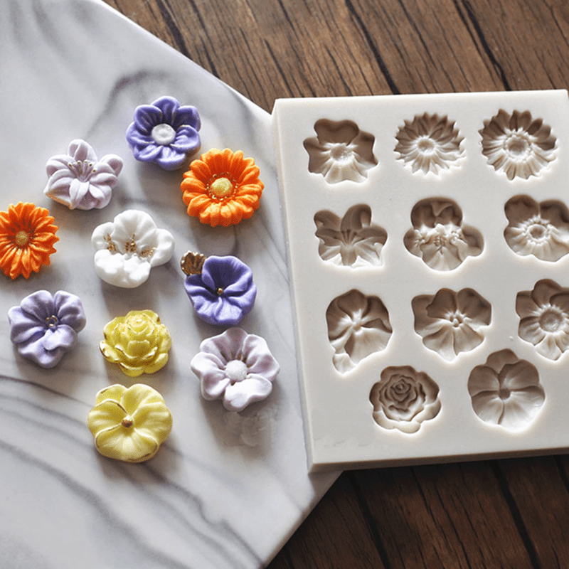 1 piece of a flower-shaped silicone mold with 11 cavities, perfect for making 3D fondant, pudding, chocolate, candy, desserts, gummy, cupcakes, handmade soap, ice cubes, ice cream, and more. Ideal for cake decorating, baking, and other kitchen items.