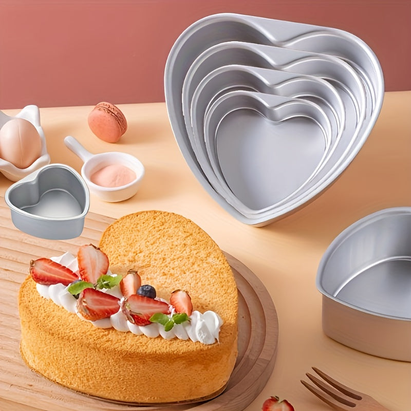 1 piece of a heart-shaped anode cake pan and 3 pieces of loose bottom cake molds. The cake pans come in sizes of 10.16cm, 15.24cm, 20.32cm, and 25.4cm with non-stick removable bottoms, perfect for baking chiffon cakes in the oven. Great for Halloween