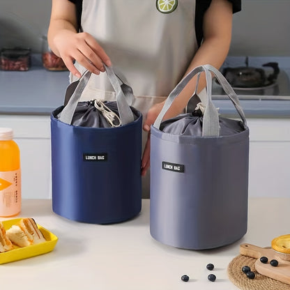 - Large round lunch bag with cylinder insulation, made of aluminum foil for portability and to keep meals warm at work.